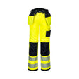 Portwest Hi-Vis håndverksbukse klasse 2 med segmenterte reflekser, Oxford-forsterkninger og 18 praktiske lommer.